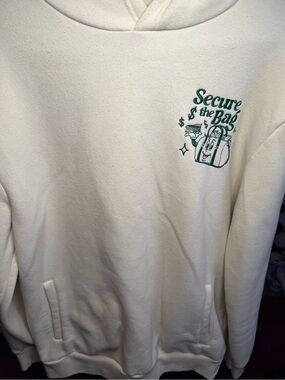 Reason “Stack That Cash” Cream Hoodie with Green Embroidered Graphics